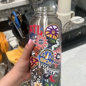 WNBA Sticker-Covered Stainless Steel Water Bottle -  Multi Color